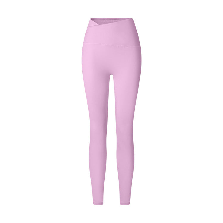 A product image showing lavender high-waisted athletic leggings with V-shaped crossover waistband against white backdrop