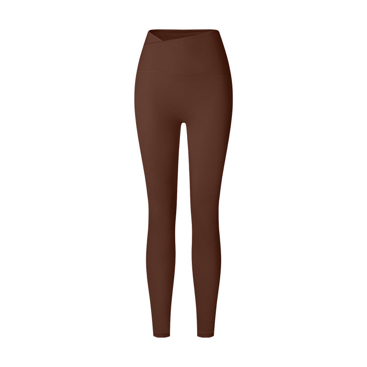 A product image featuring brown high-waisted yoga leggings with angled V-waistband and buttery-soft fabric against white background
