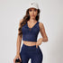 Navy denim crop top and high-waisted leggings set, top with keyhole detail, paired with white Nike cap