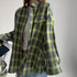 Green plaid flannel shirt with white crop top, casual oversized streetwear style