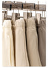 Close-up of metal clothing clips holding various beige and gray shorts with elastic waistbands and drawstrings