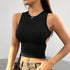 Black sleeveless crop top with high neckline and ruched waist, complemented by olive cargo pants