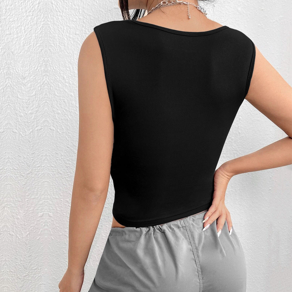 Back view detail of black sleeveless crop top with fitted silhouette, shown with grey elastic waist pants