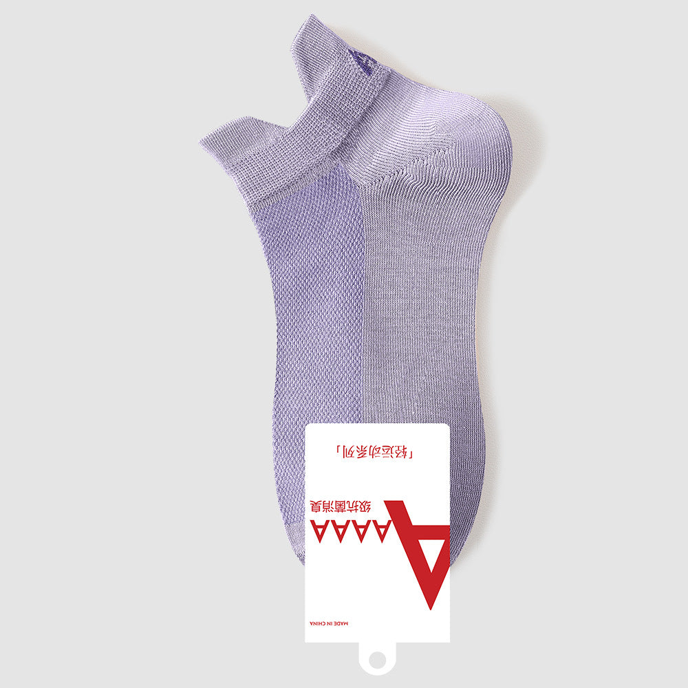 Purple antibacterial ankle socks with brand label and quality certification tags, retail presentation