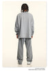 Back view of gray sweatsuit showing relaxed fit and stitching details