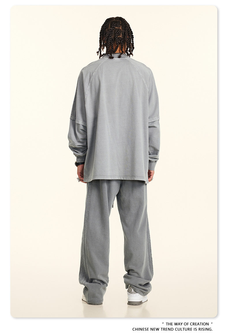 Back view of gray sweatsuit showing relaxed fit and stitching details