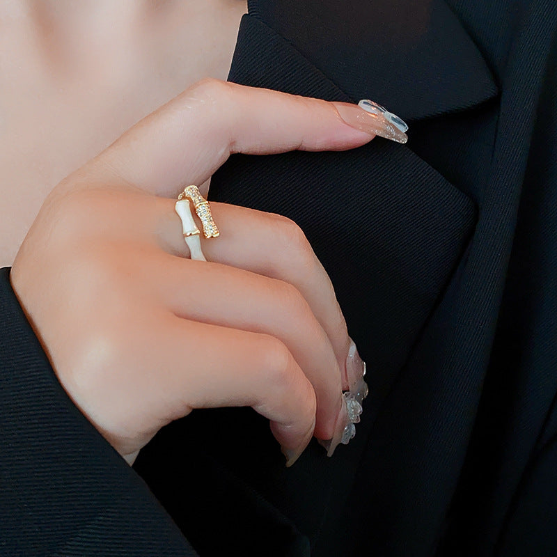 Bamboo style ring with gold and white segments on hand