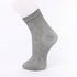 Light gray ankle sock displayed on a mannequin foot