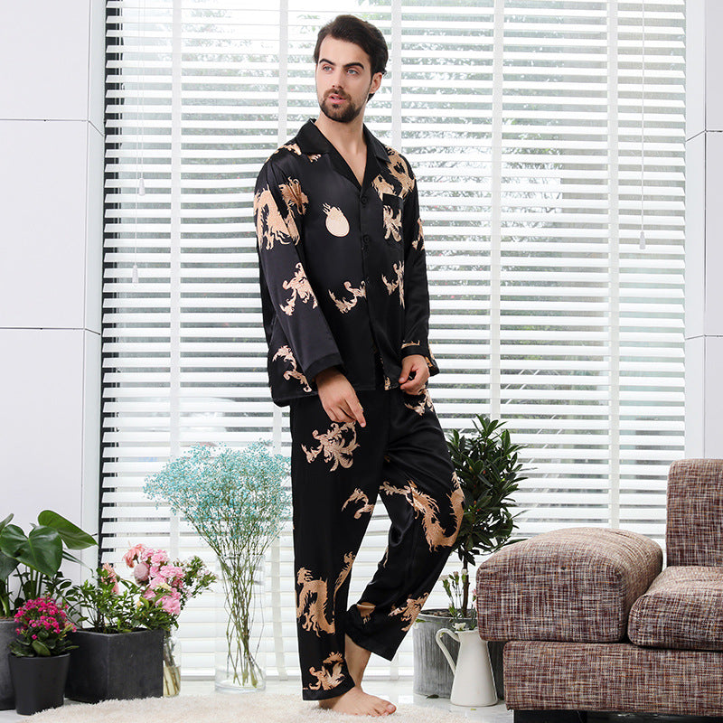 Black silk men's pajama set with golden dragon print, showcasing traditional loungewear style with all-over pattern