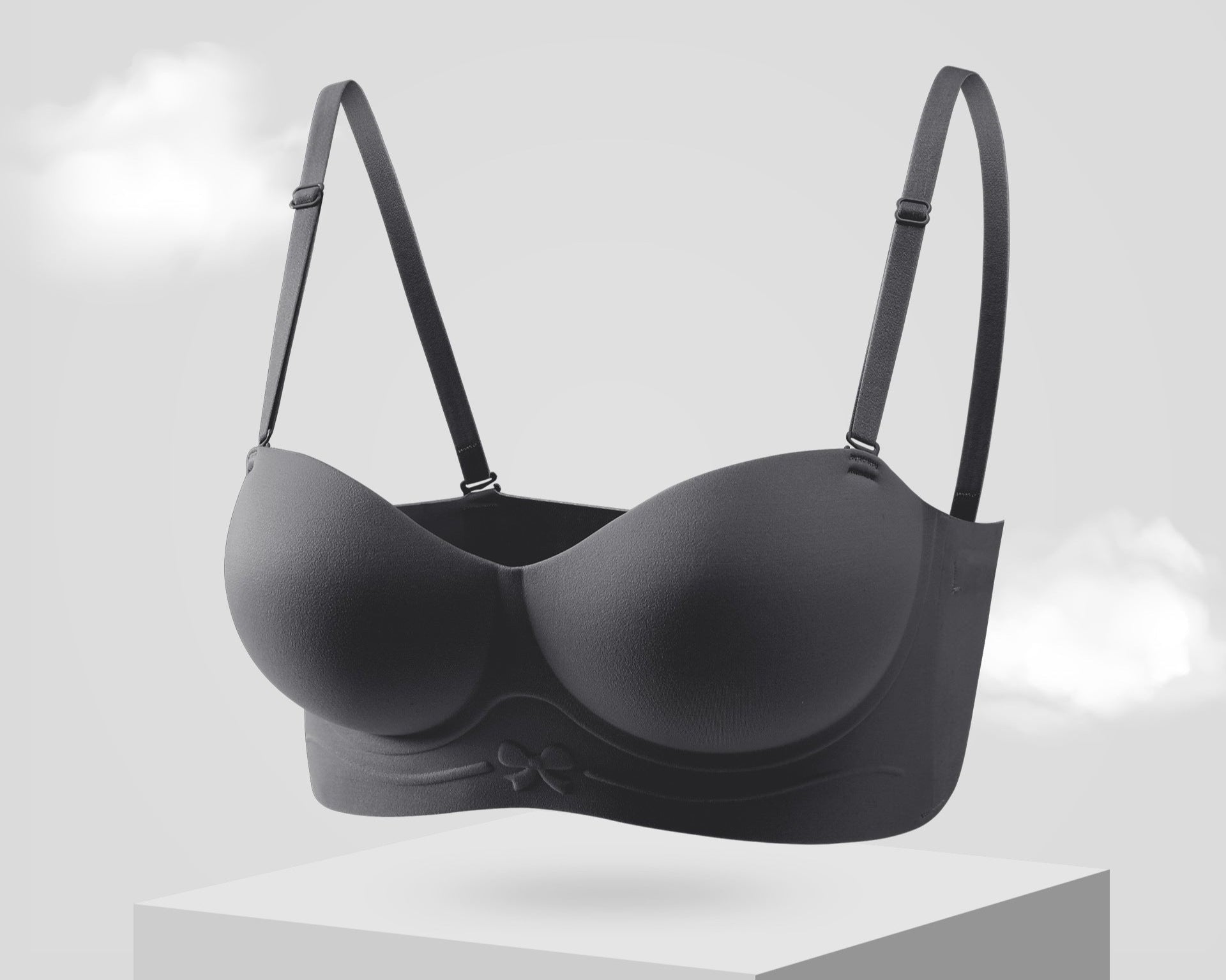 Black strapless bra with molded cups and a bow detail on the band.