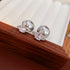 Detailed view of silver crystal orbit earrings with pearl back