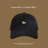 Black baseball cap featuring small embroidered corgi dog design