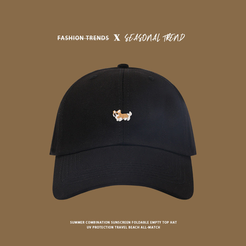 Black baseball cap featuring small embroidered corgi dog design