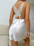 White satin slip dress with detailed lace butterfly back design