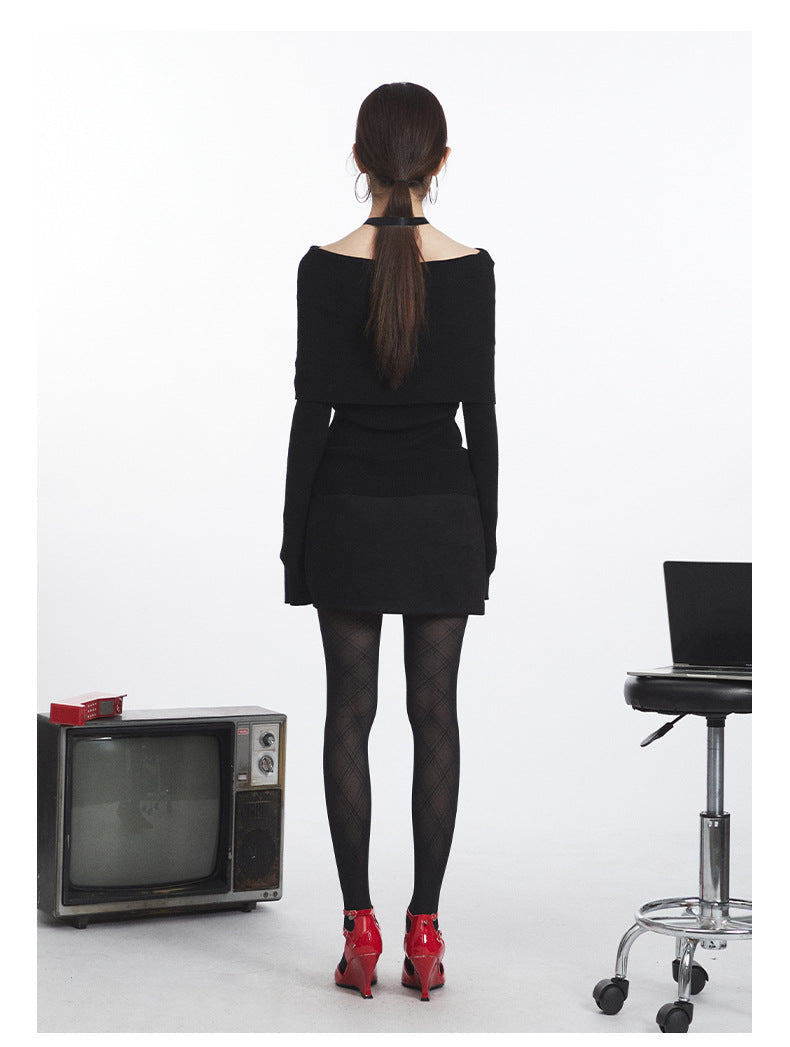 Black off-shoulder knit sweater with folded neckline and fitted silhouette. Back view revealing full length of the garment.