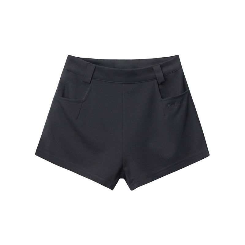 Black tailored shorts with clean lines and signature pocket design