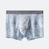 Light gray men's boxer briefs with abstract text pattern in mint and gray tones, featuring comfortable elastic waistband