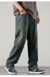 A man wearing vintage-washed loose jeans with a hand in his pocket, showcasing the front pockets and seams