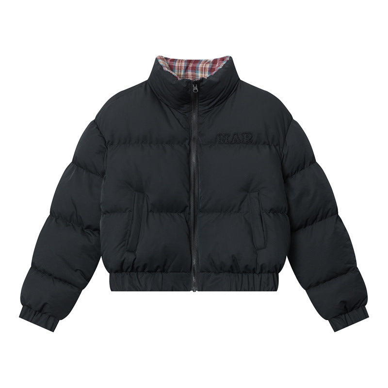 A black puffer jacket with a red plaid lining, elastic cuffs, and a front zipper, displayed against a white background