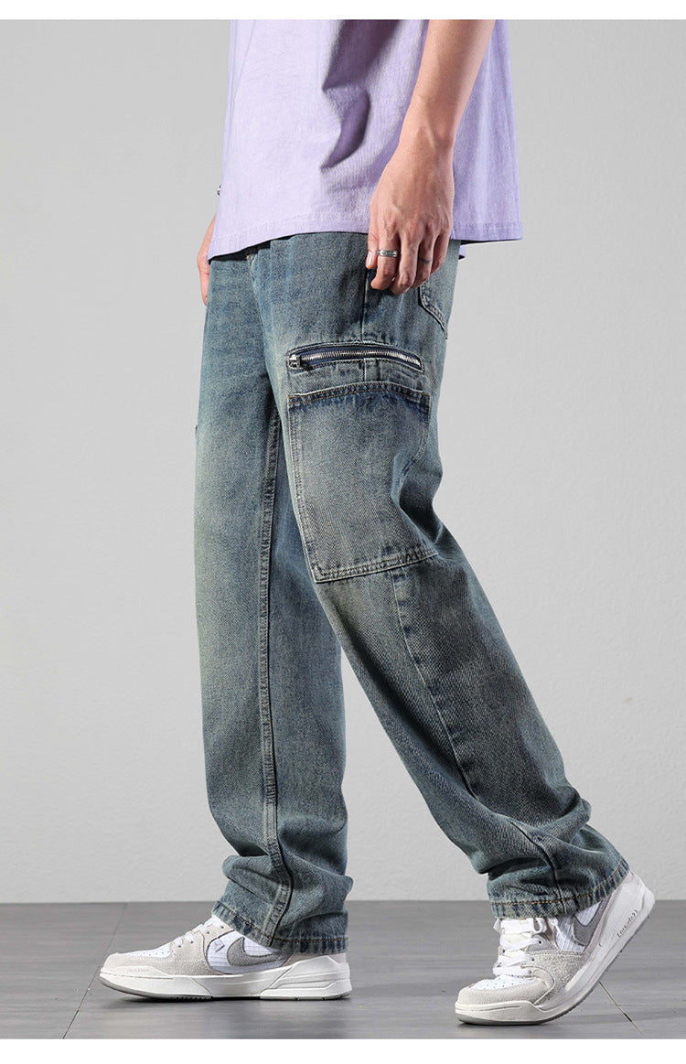 Side profile of model in vintage wash cargo jeans featuring zippered pocket detail, paired with lavender tee and white sneakers