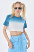 Close-up of blue ombré cropped t-shirt with chain belt, model in side profile with rectangular sunglasses