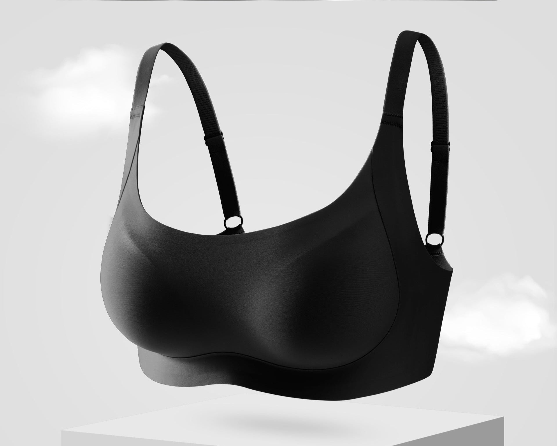 Classic black seamless bra with wide support band and adjustable straps, designed for a sculpted fit.