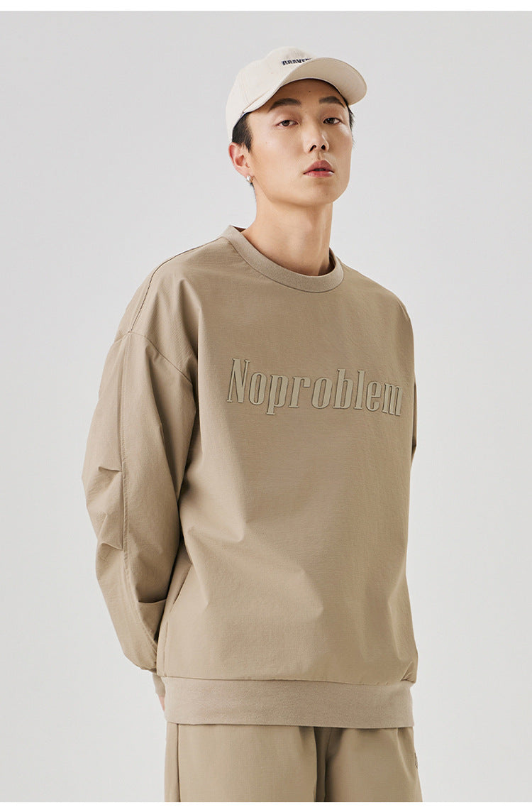 Front view of the beige "NoProblem" sweatshirt, showcasing its minimalist and versatile design