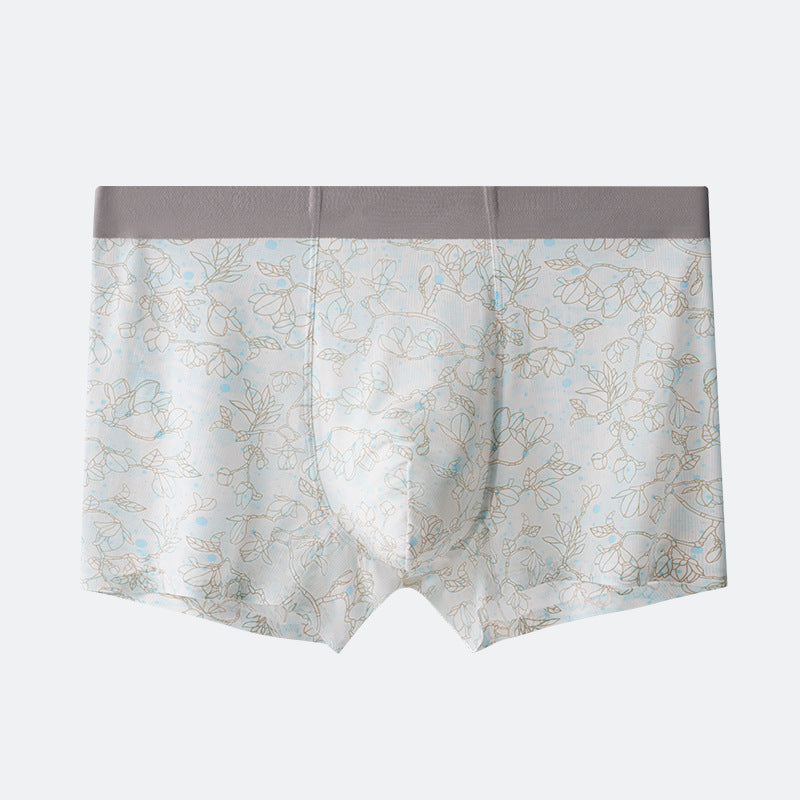 Men's boxer briefs with subtle floral outline pattern on light blue background and gray elastic waistband