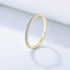 Light blue topaz eternity band in gold setting with delicate prong design and 925 stamp