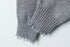 Cuff detail showing ribbed texture and distressed finish at sleeve end.