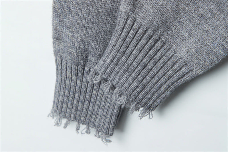 Cuff detail showing ribbed texture and distressed finish at sleeve end.