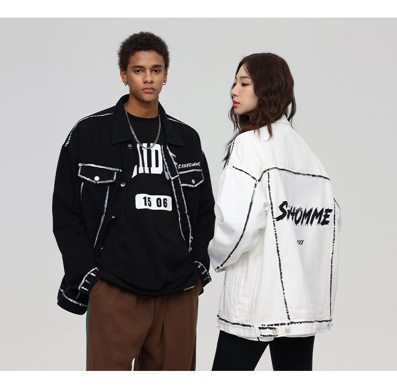 A man and woman are standing side by side. He wears black SANHOMME jacket with '15 06' shirt, she wears white outline denim jacket
