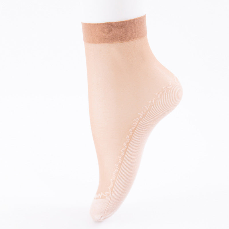Nude sheer ankle sock with ribbed sole detail photographed on white background