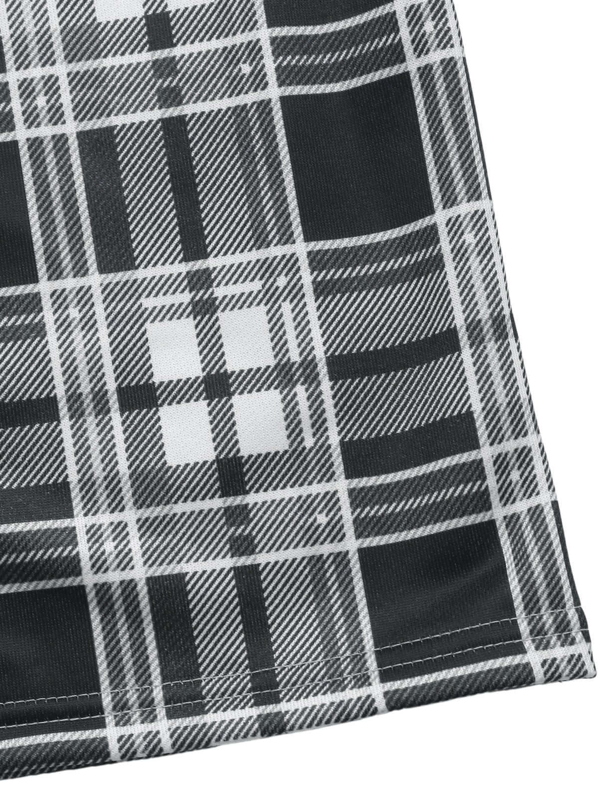 Hem detail of plaid pants showcasing neat stitching and straight-leg design.