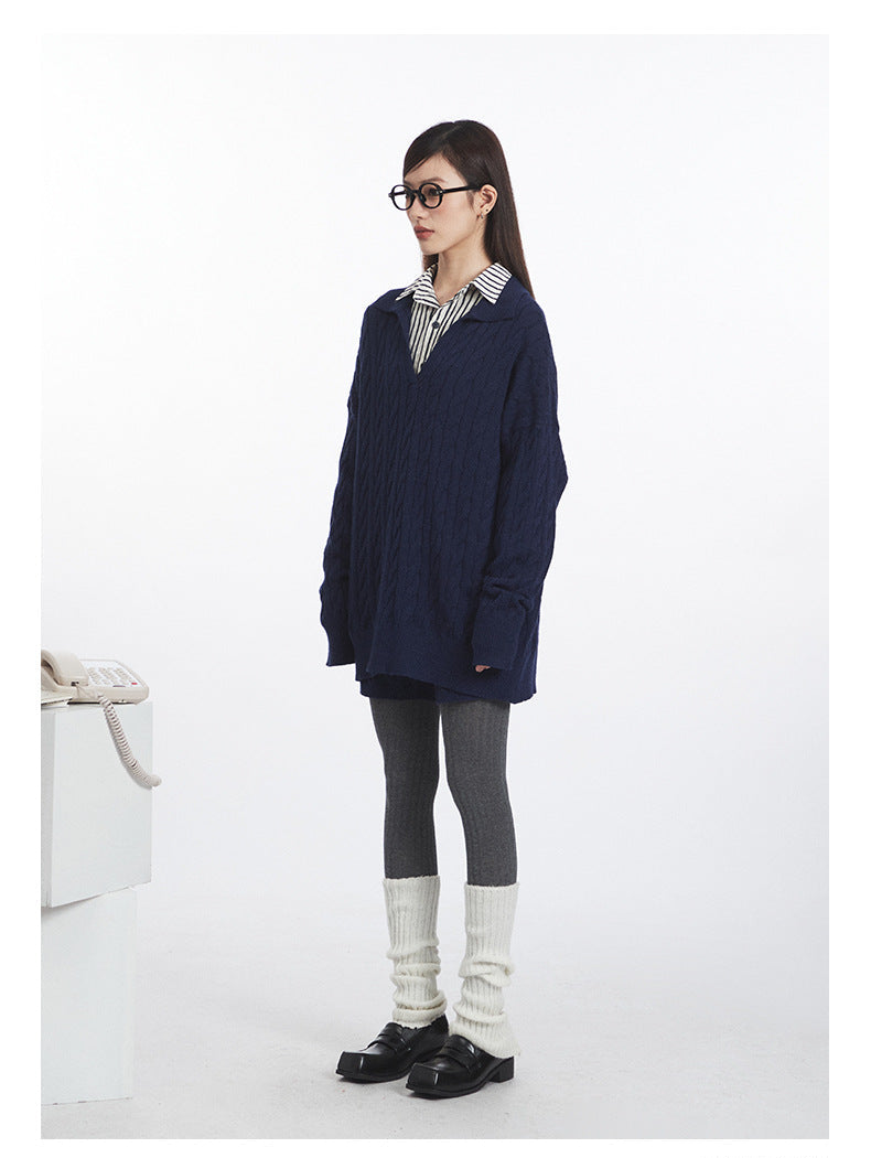 Side angle of knit set showing sweater's drape and shorts' relaxed fit, styled with grey tights.
