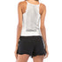 Back view of white camisole showing lace panel detail with black shorts