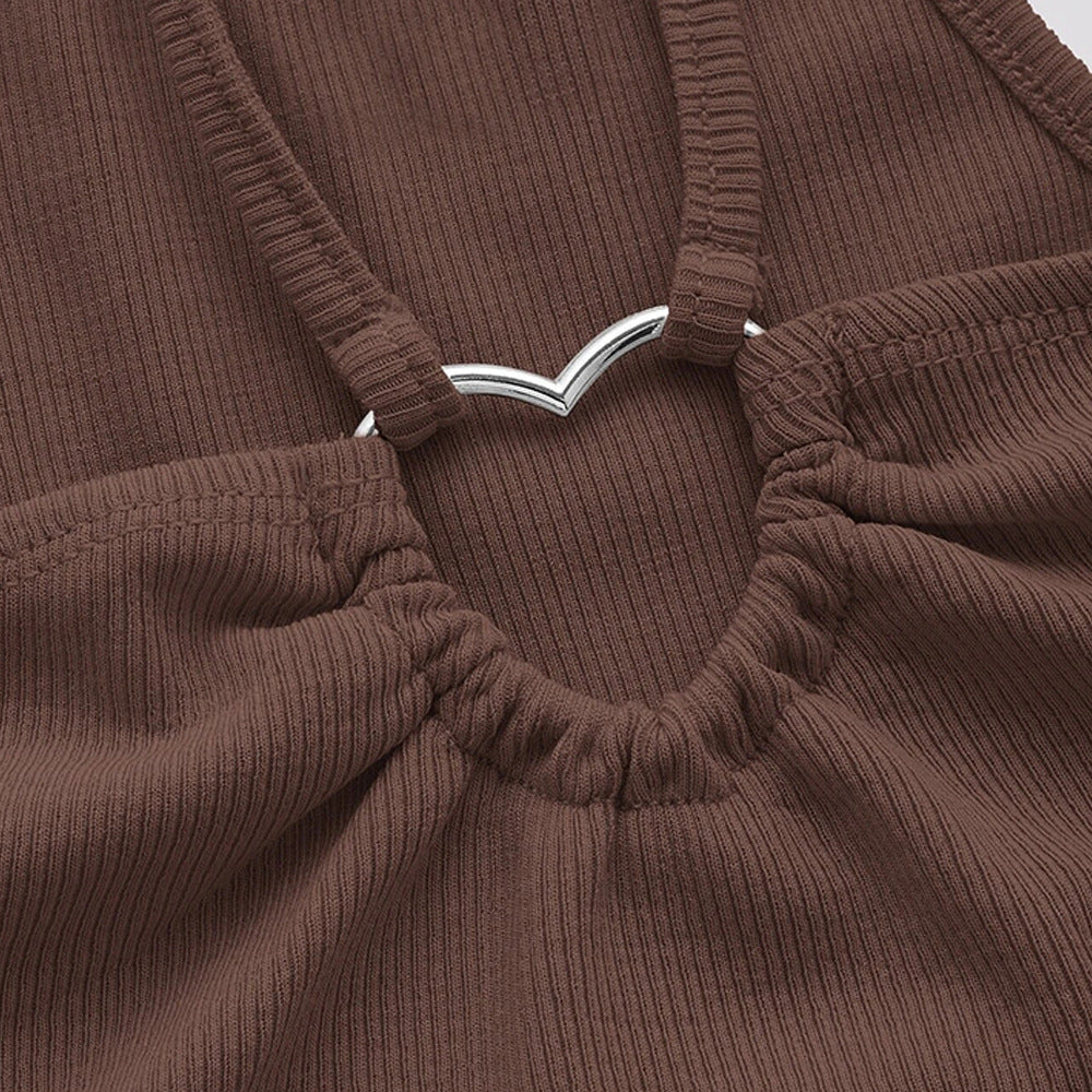 Close-up detail of brown ribbed crop top showing silver V-shaped metal connector and gathered elastic neckline construction
