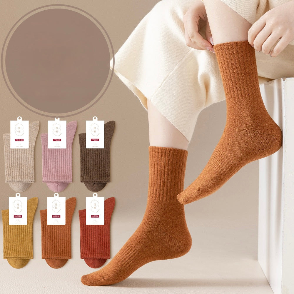 Pure cotton ribbed crew socks in camel brown shown on feet, with display of six color options below