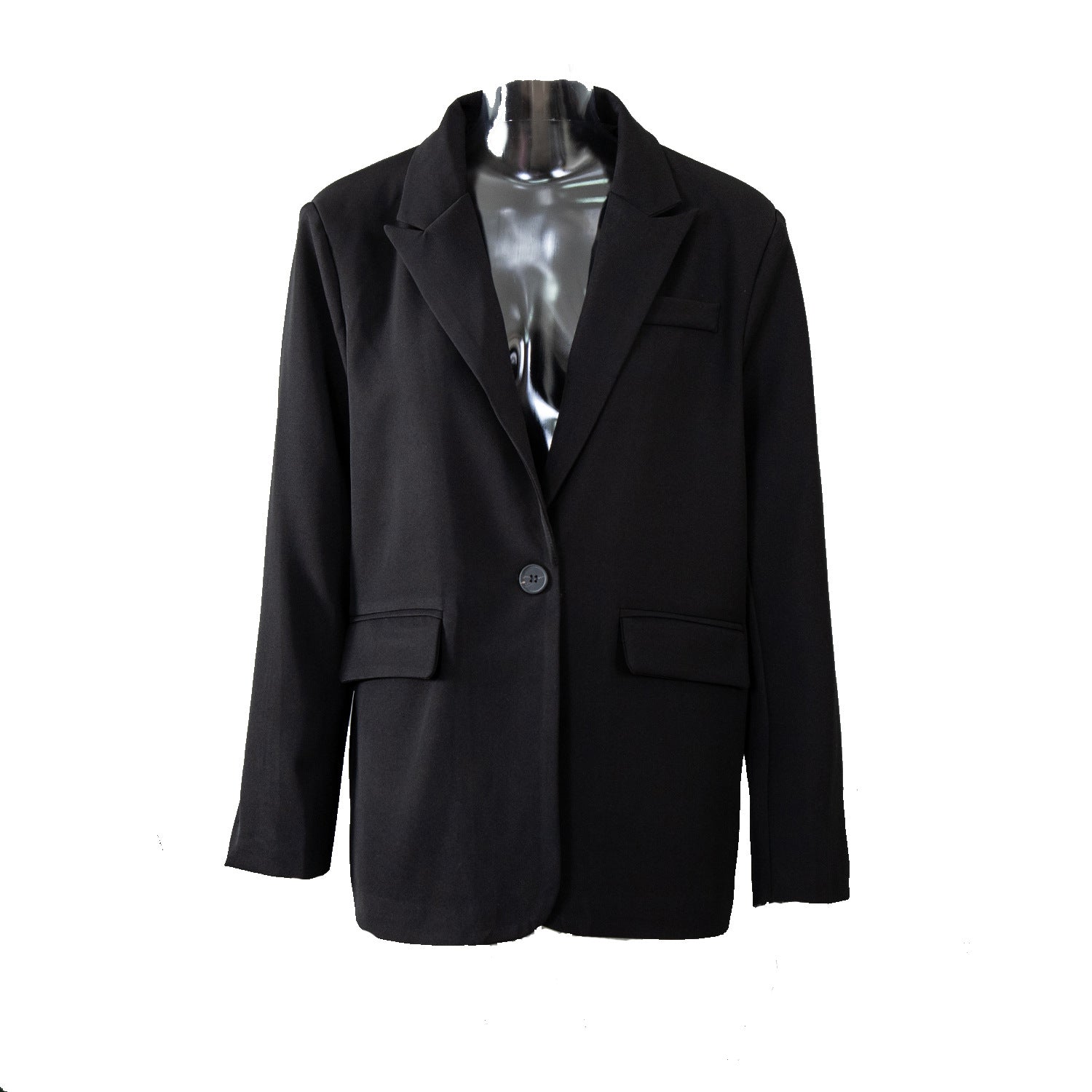 Black oversized blazer on a transparent mannequin, showcasing a structured silhouette with notched lapels and flap pockets