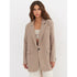 Neutral beige blazer styled over a cream bandeau top and white high-waisted shorts with a brown leather belt, creating a sophisticated ensemble