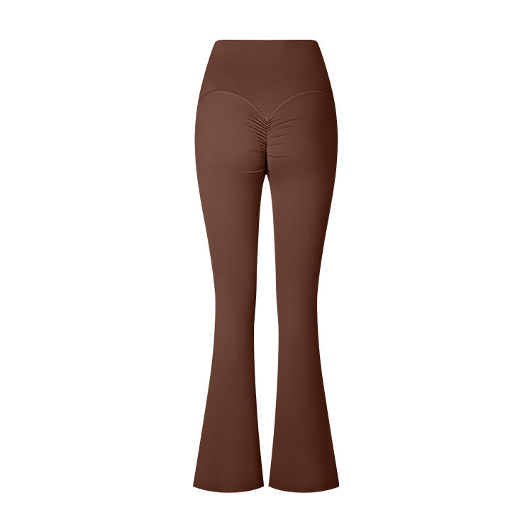 A product photo of brown flared yoga pants with a high waistband and ruched center seam detail, displayed against a white background