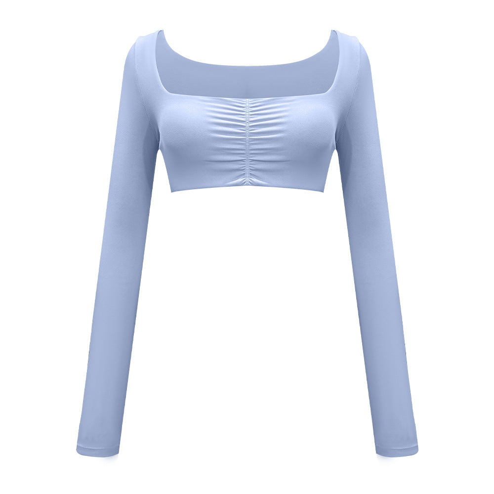 Light blue long-sleeve crop top featuring square neckline and gathered center detail on white backdrop