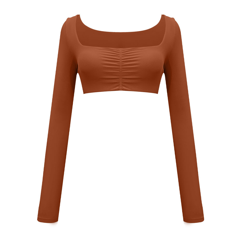 Terracotta brown cropped athletic top with square neck and gathered center detail, shown flat lay