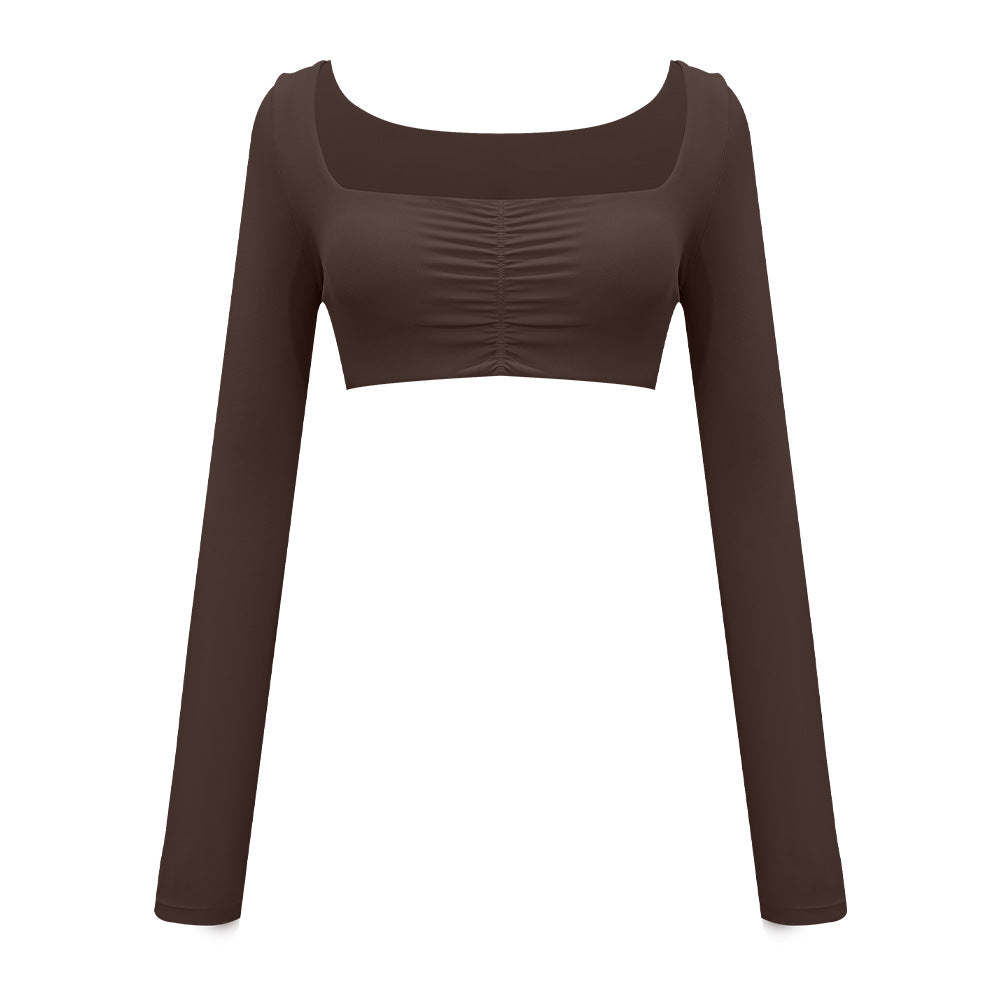 Dark brown long-sleeve athletic crop top with ruched front panel and square neckline on white background