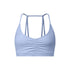 A light blue strappy sports bra with ruched center detail and thin double-strap design shown against white background