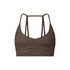 A dark brown strappy sports bra with ruched center detail and thin double-strap design shown against white background