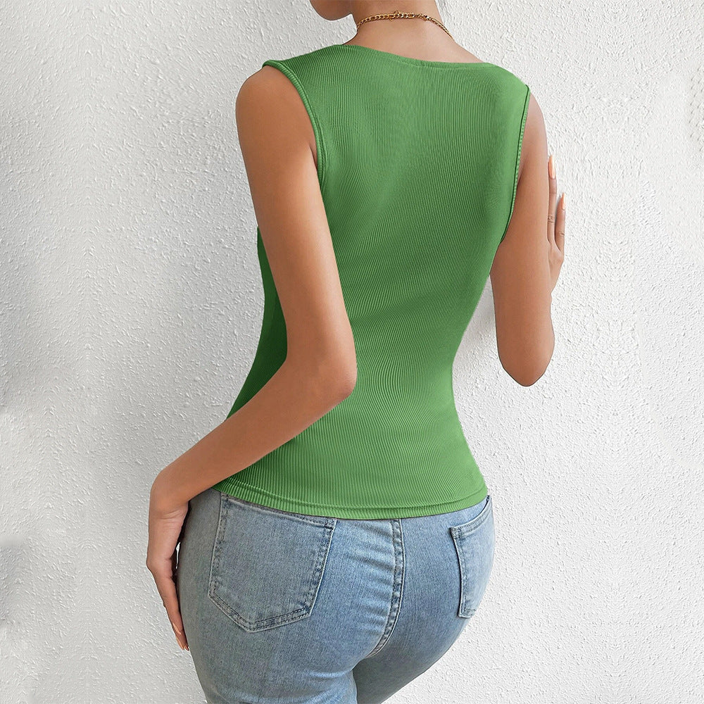 Back view of sage green fitted tank showing smooth ribbed texture, paired with high-waisted jeans