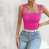 Front detail of hot pink tank top with square neckline and ruched bust, styled with white belt