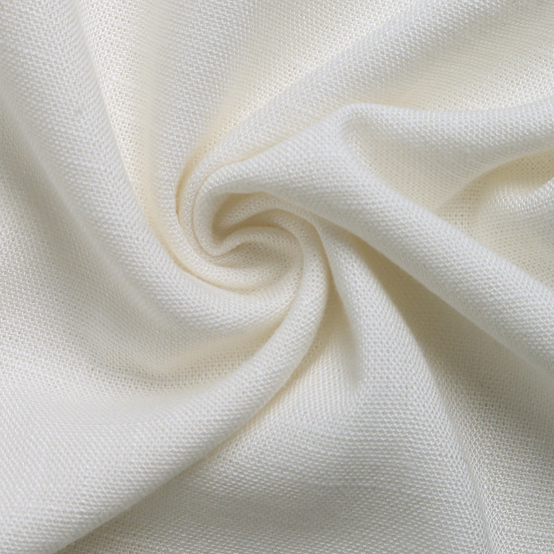 Swirled close-up of lightweight linen fabric in off-white color, showcasing texture.