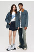 Front view of male and female models in matching oversized denim jackets with brown collars and graphic tees